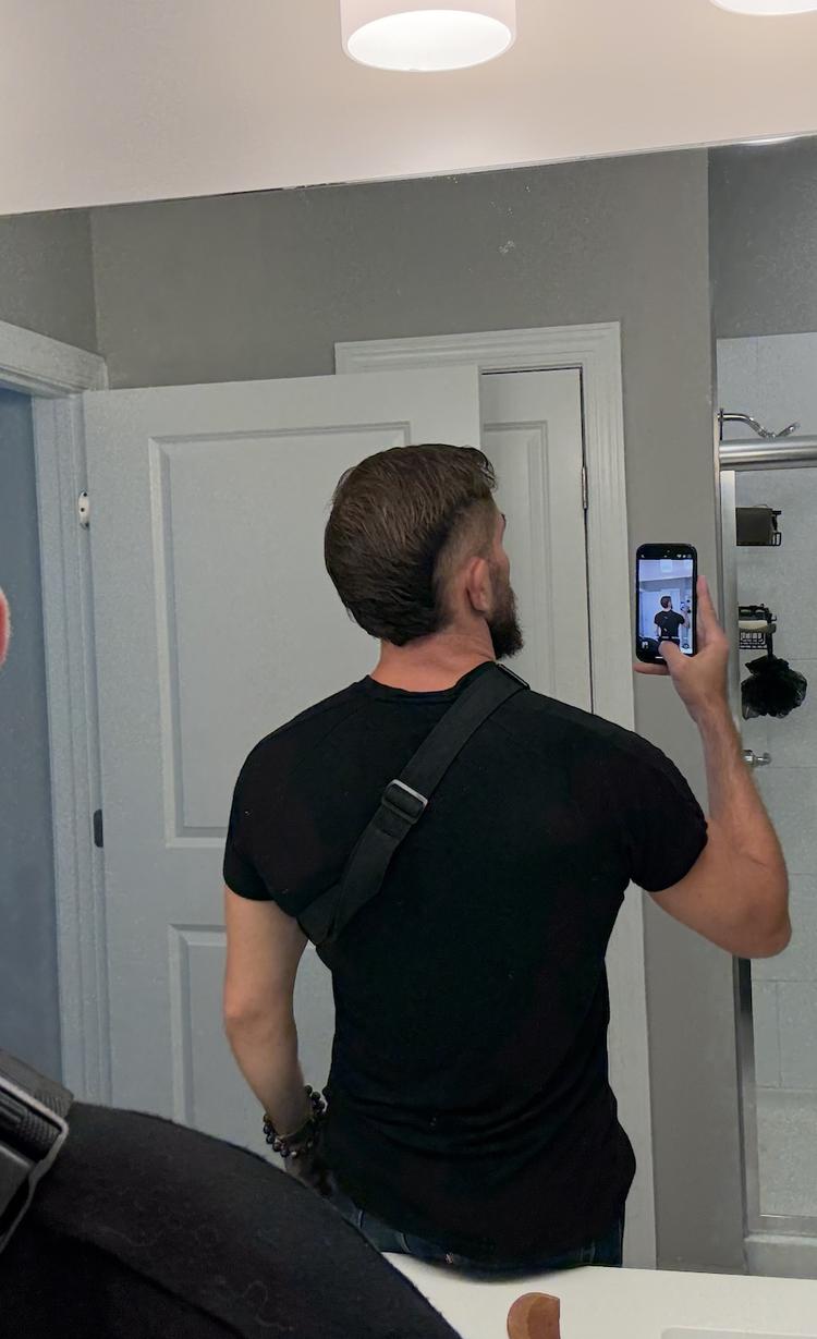 Founder's hair grown back out, styled back